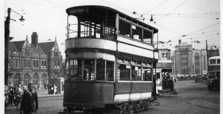 Trams still running from Mersey Square with The Plaza in the background