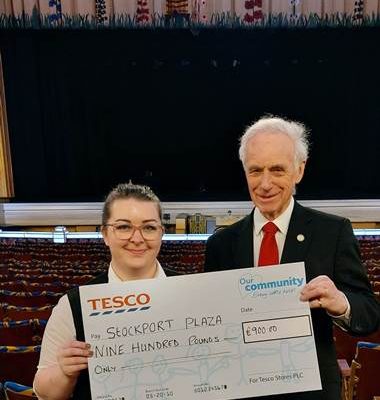 The Plaza team take delivery of a generous donation Cheque from Tesco Extra in Stockport where every little....or in this case a Lot!.....Helps 